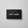 Matte black Prime Tee Supply gift card on a light grey background